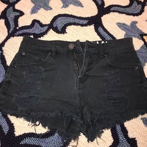Black ripped volcom shorts